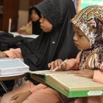 DUA pelajar KAFA khusyuk membaca Al-Quran di Pusat KAFA Al-Manshoor, Batu Uban di sini.