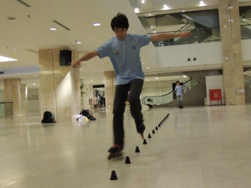 Oh Chee Kuan, champion at the 2011 Nanning, Guang Xi, China competition demonstrates freestyle skating at Time Square. 