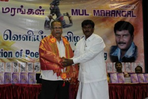 மாநில இரண்டாம் துணை முதல்வர் பேராசிரியர் ப.இராமசாமி அவர்களுக்குப் பொன்னாடைப் போற்றி மாலை அணிவித்தார் கவிஞர் செ.குணாளன்.