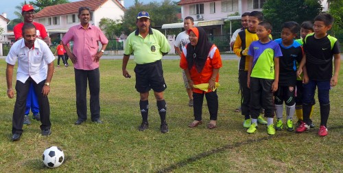 Little Messi in the making - Young footballers looking at Ramkarpal’s kick-off the launch of their 7-a-side football. Behind Ramkarpal (on the left) is Seri Delima assemblymember RSN Rayer. 