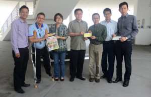 A group photo of Lim (third from left) and MPPP council member Jeff Ooi (centre), together with representatives from both NGOs, Auto Mall and Zeon Properties, posing with the cheques.