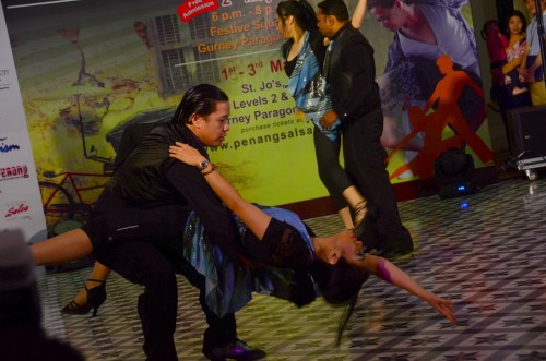 Raja Syarafina Raja Shuib, deputy chairman of Penang Salsa Fiesta 2015 Committee (front) and her group of salsa dancers on the dance floor.