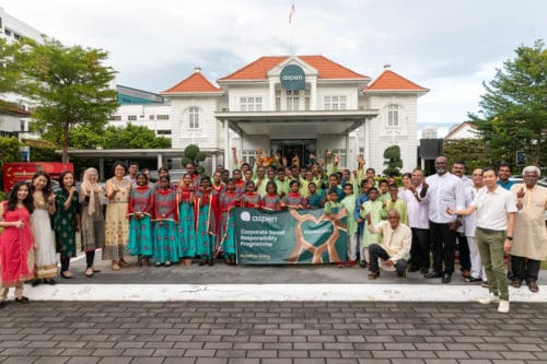 group photo with ramakrishna ashram children at aspen's head office