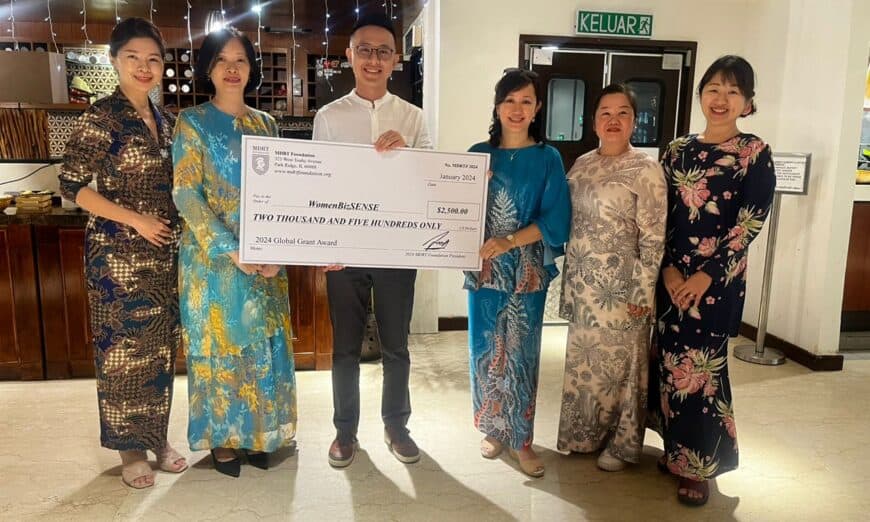 wbs group photo receiving mock cheque (1)